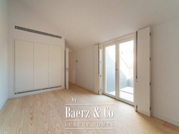 photo 17 Three-Bedroom Duplex with Balcony, Two Parking Spaces, and Storage Room